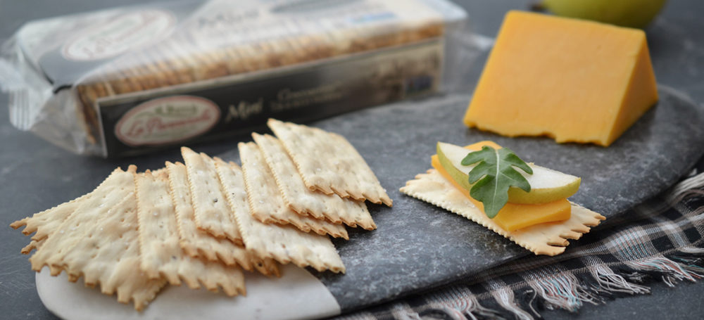 Cracked Pepper Mini Croccantini on a slab with cheese and apple