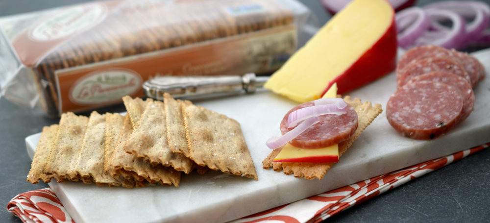 Whole Wheat Mini Croccantini on a slab with cured meat and cheese