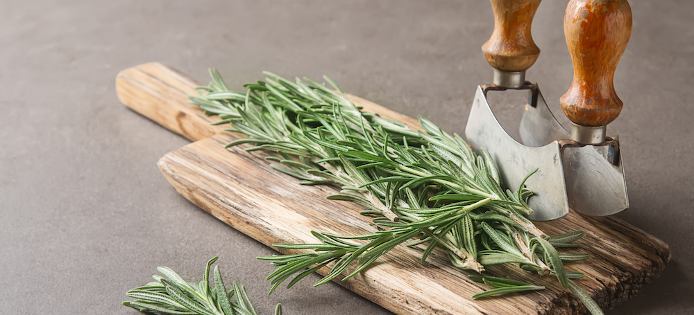 Cutting board with fresh rosemary